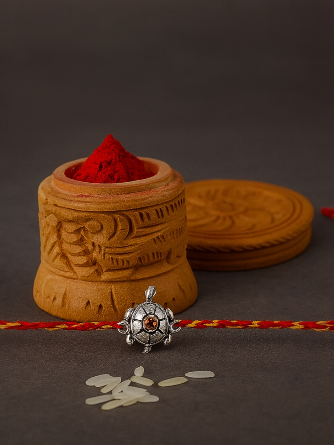 Special Tortoise Moli Rakhi with Red Stone